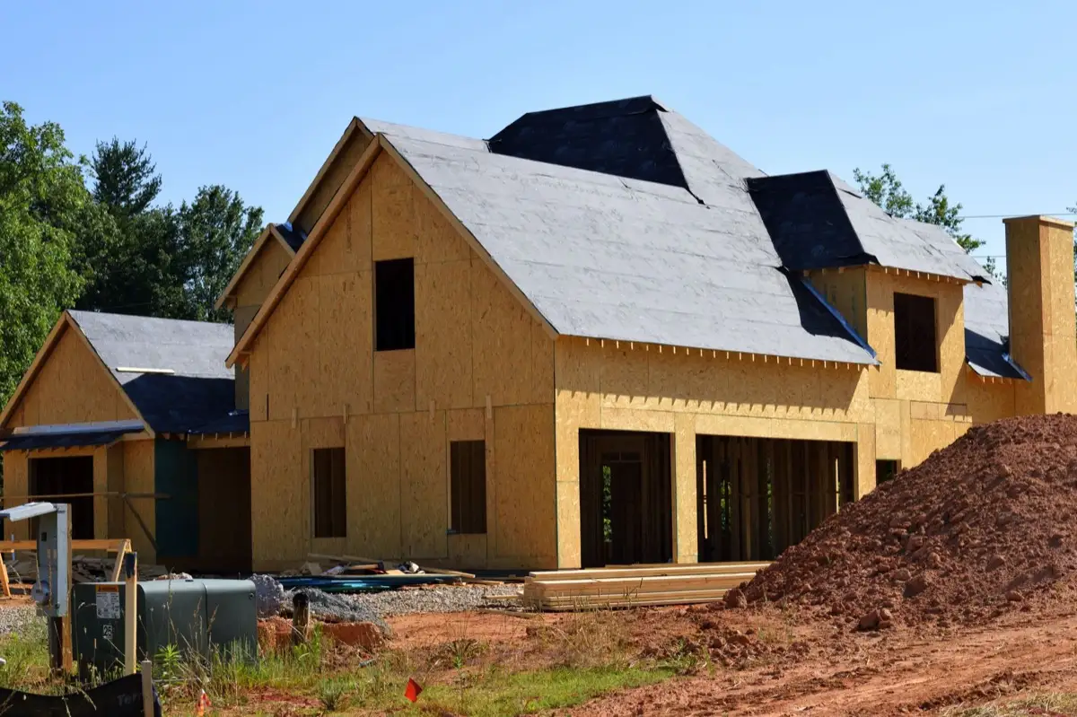 House with new roof decking and synthetic underlayment during a roof replacement in Redding, CA