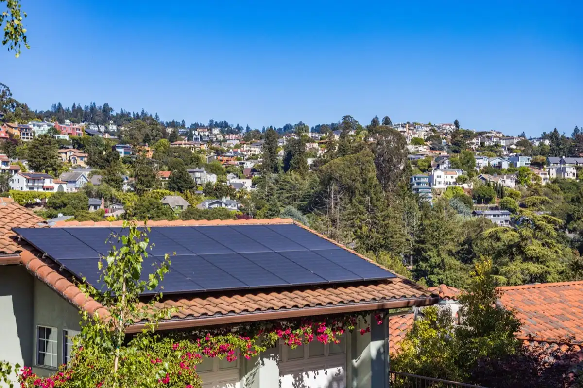 Hips and valleys across a run of rooflines in Redding, CA, where two planes meet and hand their water to one line